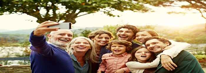 grandfather taking a Multigenerational family photo, benefits of using Prayers for Family