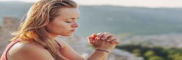 Mom praying for her family.