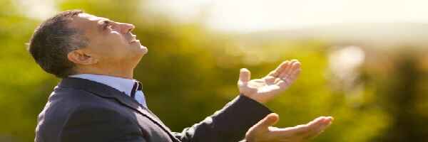 Man praying with open palms.