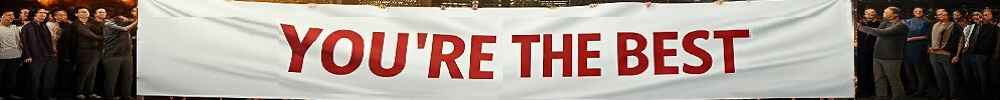 People holding up a banner that says 'You're The Best,' symbolizing recognition and acknowledgment for overcoming self-doubt and showcasing talents.